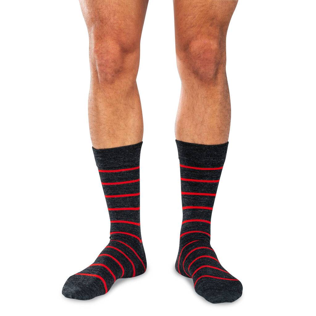 Man Wearing Charcoal Grey Merino Wool Dress Socks Decorated with Bright Red Stripes