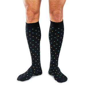 Man Wearing Black Wool Over the Calf Dress Socks Decorated with Small Colorful Polka Dots