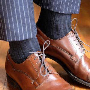Man Wearing Navy Blue Cotton Dress Socks with Navy Pinstripe Dress Pants and Brown Dress Shoes 