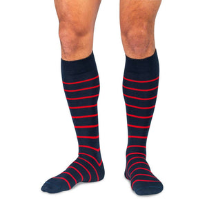 Model Wearing Navy Blue Over the Calf Dress Socks with Red Stripes