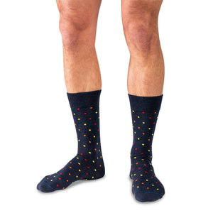 Man Wearing Navy Blue Mid-Calf Length Merino Wool Dress Socks Decorated with Small Colorful Polka Dots
