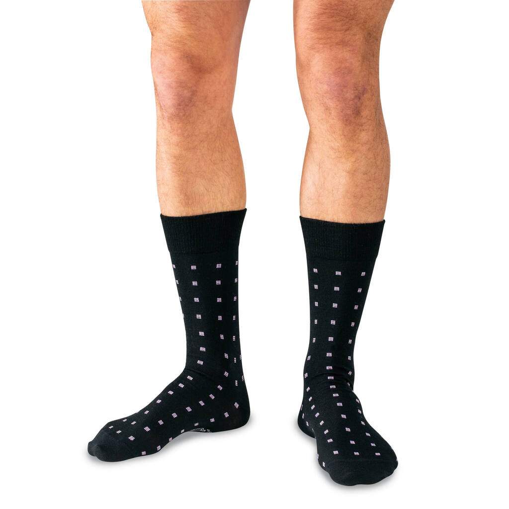 Man Wearing Black Mid-Calf Length Wool Dress Socks Decorated with Purple Squares