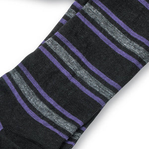 close up photo of black dress socks with purple and grey stripes