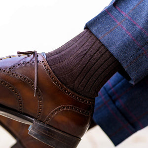brown merino wool dress socks with dark brown brogue dress shoes and blue plaid trousers