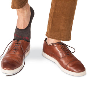 brown wool no-show socks with light brown dress sneakers and tan pants