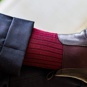 burgundy ribbed dress socks with chelsea boots and grey dress pants