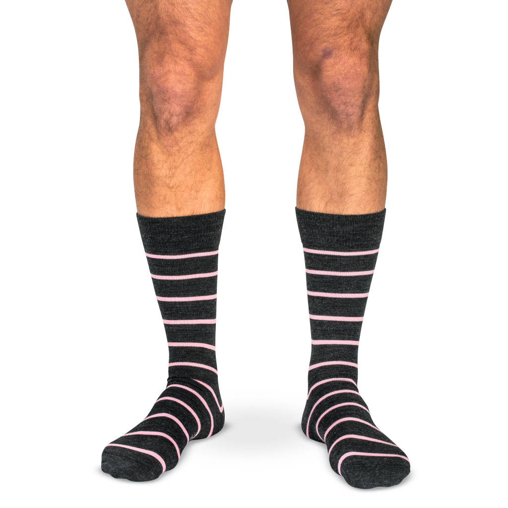 model wearing charcoal merino wool dress socks with pale pink stripes