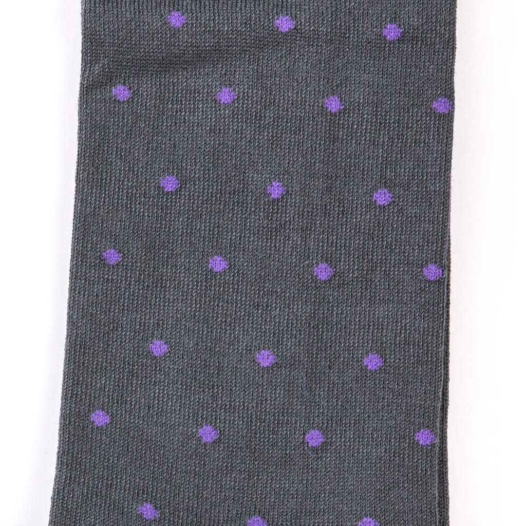 sock laying flat close up to see the detail of a purple dots on grey cotton sock