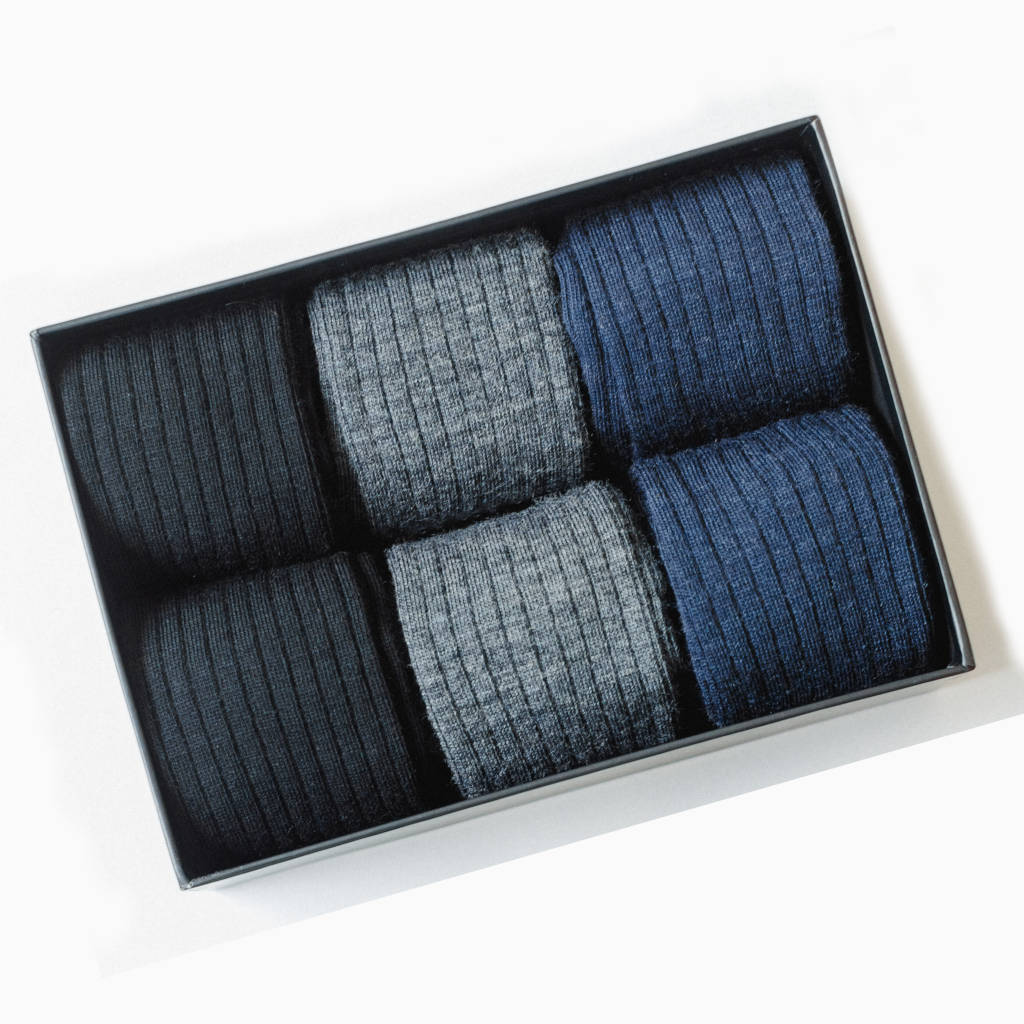 gift box filled with black grey and navy merino wool dress socks for men