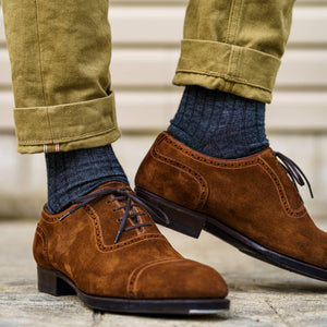 man walking wearing grey heather wool dress socks with tan chinos and brown suede dress shoes