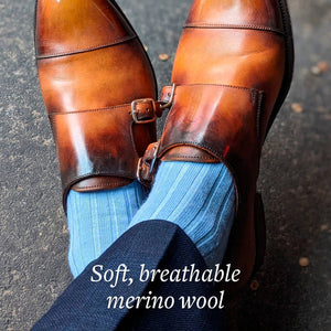 light blue ribbed merino wool dress socks with brown monkstraps and a navy suit