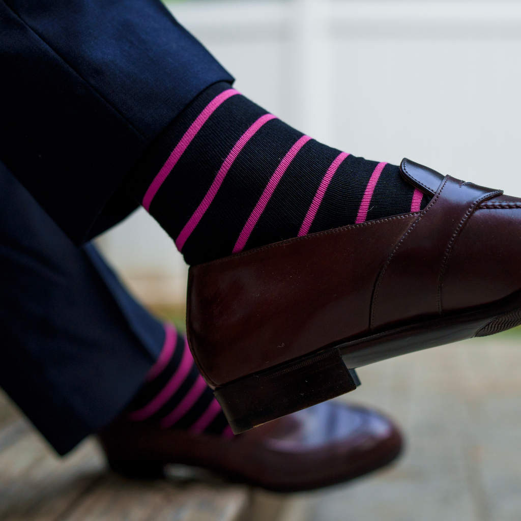 black dress socks with bright pink stripes