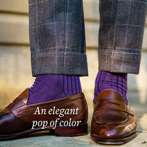 purple dress socks with windowpane trousers and brown penny loafers