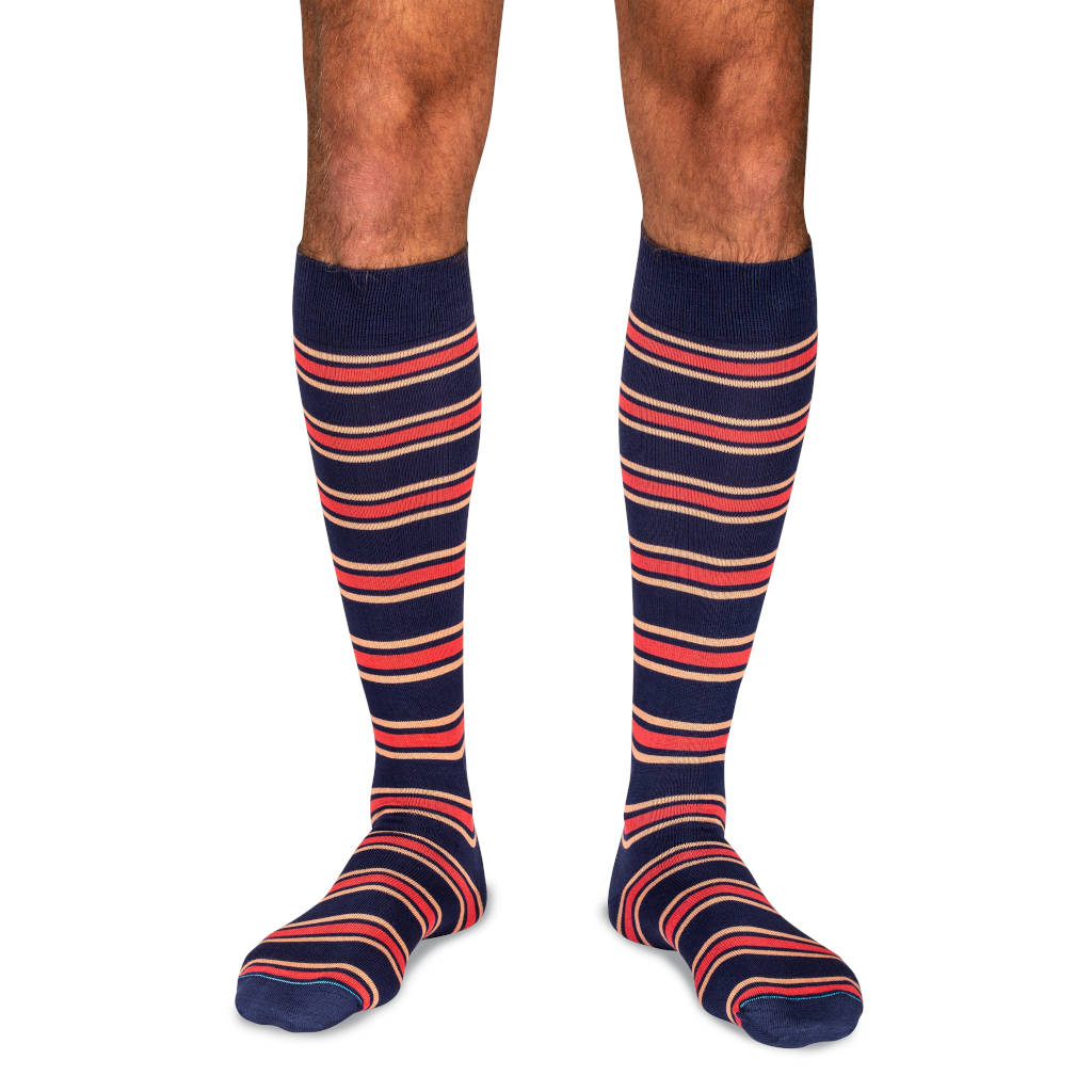 model wearing navy cotton dress socks with colorful stripes