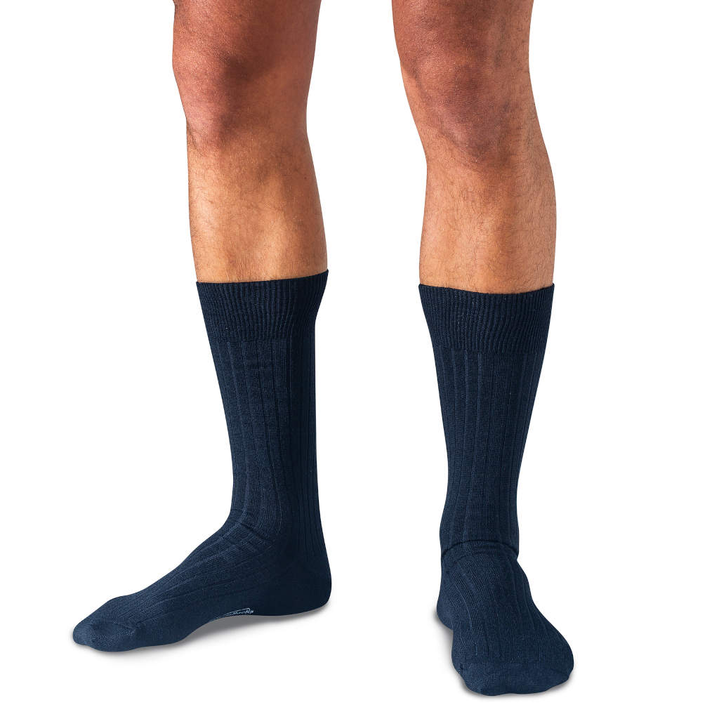 model wearing navy wool mid-calf dress socks
