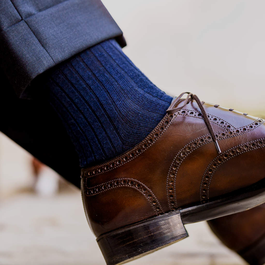 navy merino wool dress socks with brown oxford dress shoes and grey trousers