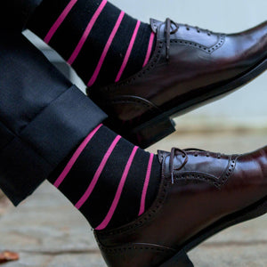 black cotton over the calf dress socks decorated with bright pink horizontal stripes