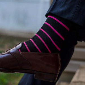 pink striped dress socks with dark navy trousers
