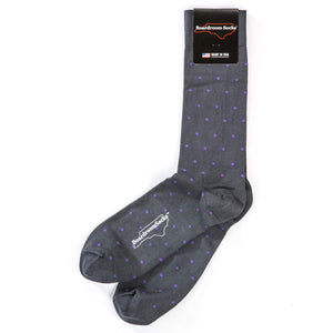pair of grey cotton dress socks decorated with small purple polka dots